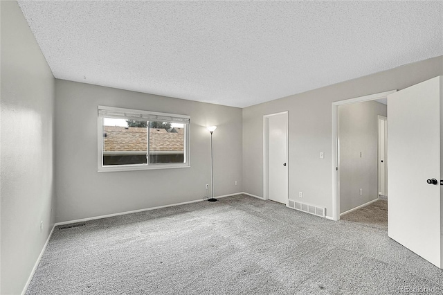 3890 S Atchison Way Unit B, Aurora, CO 80014 - unfurnished room featuring carpet flooring and a textured ceiling