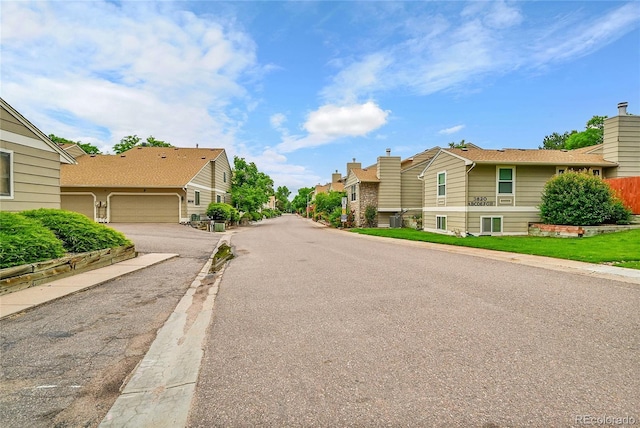 3890 S Atchison Way Unit B, Aurora, CO 80014 - view of asphalt road featuring a residential view and curbs