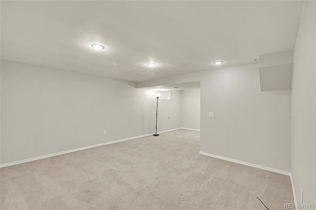 3890 S Atchison Way Unit B, Aurora, CO 80014 - finished below grade area featuring light colored carpet and recessed lighting