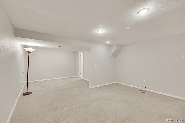 3890 S Atchison Way Unit B, Aurora, CO 80014 - finished basement with light colored carpet, a textured ceiling, and recessed lighting