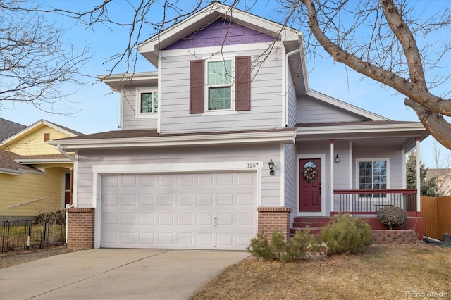 traditional-style house featuring driveway, an attached garage, covered porch, fence, and brick siding