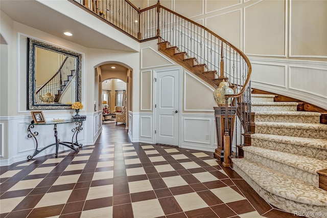 entrance foyer with a towering ceiling