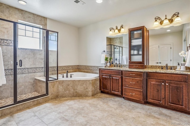 bathroom with shower with separate bathtub and vanity