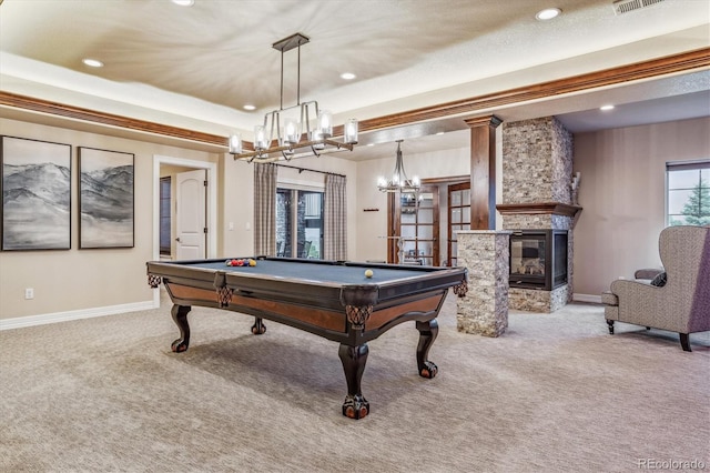 rec room with light carpet, a stone fireplace, and billiards