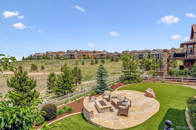 view of yard featuring a patio area and an outdoor fire pit