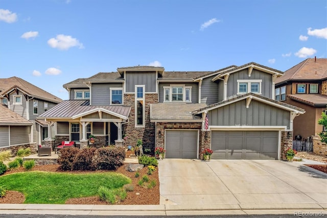 craftsman house featuring covered porch and a garage