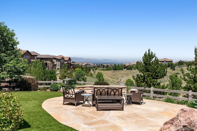 view of patio / terrace with a mountain view and outdoor lounge area