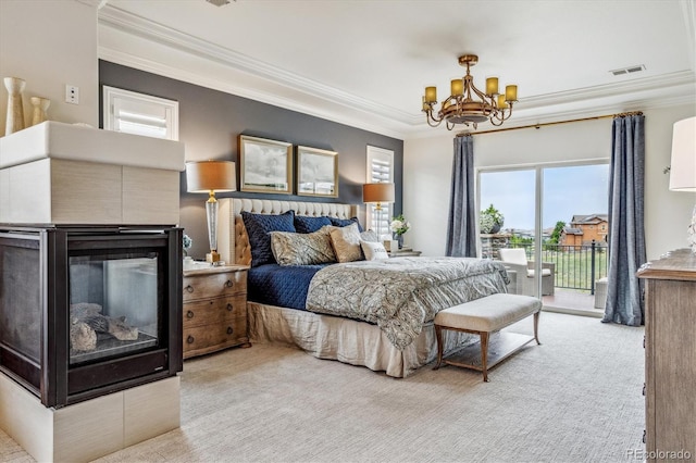 bedroom with an inviting chandelier, access to exterior, light colored carpet, and multiple windows