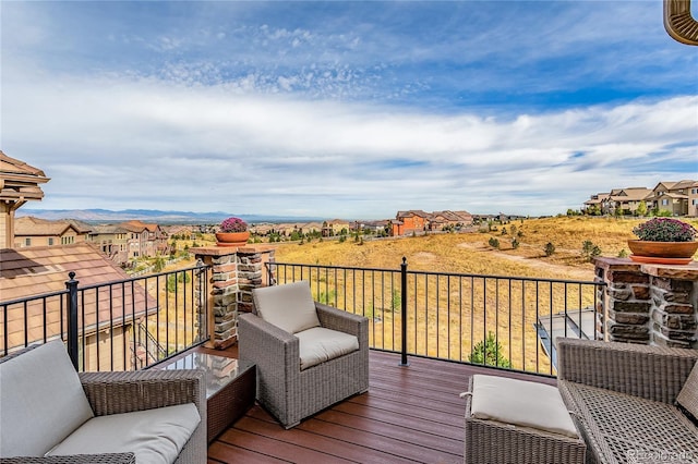 wooden deck featuring an outdoor hangout area