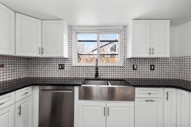 kitchen with dishwasher, sink, dark stone counters, decorative backsplash, and white cabinets