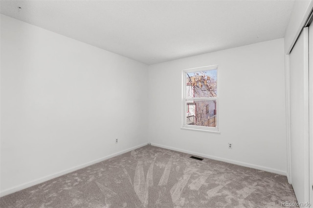 unfurnished room with carpet