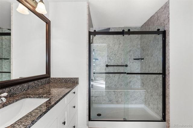 bathroom with vanity and an enclosed shower