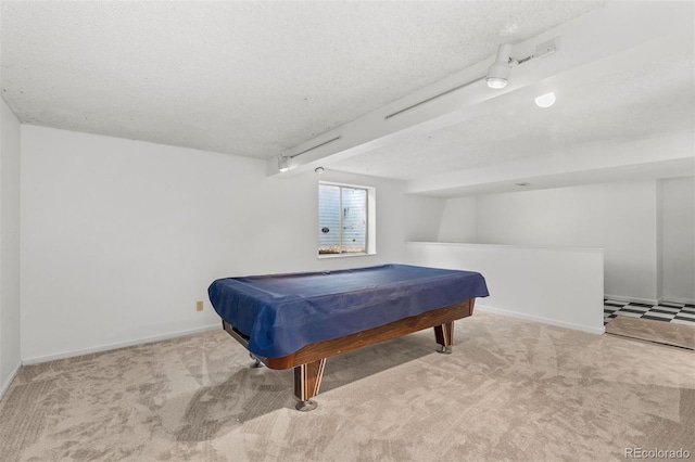 rec room with light carpet, a textured ceiling, and pool table