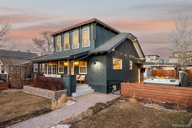 4452 Stuart St, Denver, CO 80212 - view of front of home featuring covered porch, a gate, fence, a shingled roof, and stucco siding