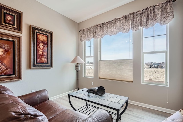 interior space featuring light wood-style floors and baseboards