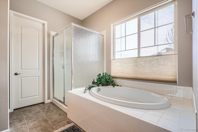 full bathroom featuring a stall shower, tile patterned floors, and a bath