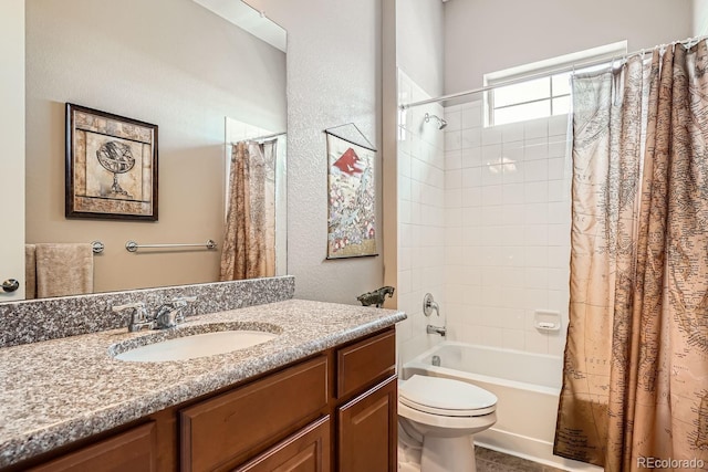 full bathroom featuring toilet, vanity, and shower / tub combo with curtain