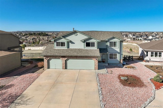 1944 Queens Canyon Ct, Colorado Springs, CO 80921 - traditional-style home with brick siding, an attached garage, driveway, and roof with shingles