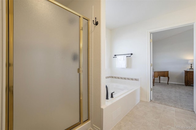 1944 Queens Canyon Ct, Colorado Springs, CO 80921 - full bath featuring a stall shower, a garden tub, and tile patterned floors