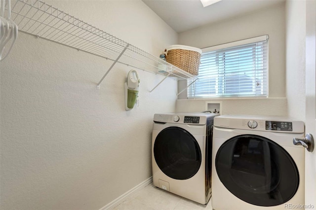 1944 Queens Canyon Ct, Colorado Springs, CO 80921 - clothes washing area with separate washer and dryer, baseboards, a textured wall, light tile patterned flooring, and laundry area