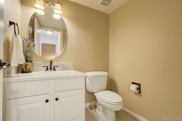 1944 Queens Canyon Ct, Colorado Springs, CO 80921 - bathroom with vanity, a textured wall, tile patterned flooring, toilet, and visible vents