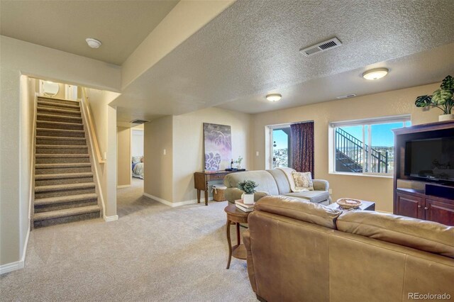 1944 Queens Canyon Ct, Colorado Springs, CO 80921 - living area with baseboards, light carpet, stairway, a textured ceiling, and visible vents