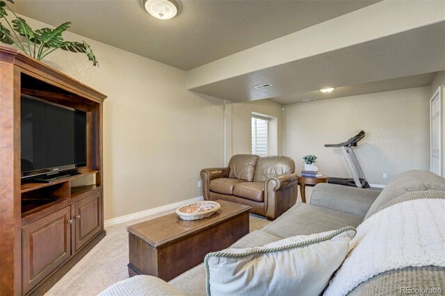 1944 Queens Canyon Ct, Colorado Springs, CO 80921 - living room featuring baseboards and light carpet