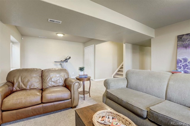 1944 Queens Canyon Ct, Colorado Springs, CO 80921 - living room with visible vents, baseboards, carpet flooring, and stairs