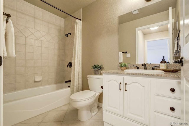 1944 Queens Canyon Ct, Colorado Springs, CO 80921 - full bathroom with shower / bath combination with curtain, toilet, a textured wall, vanity, and tile patterned flooring