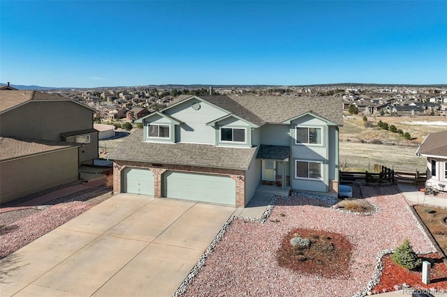 1944 Queens Canyon Ct, Colorado Springs, CO 80921 - view of front of home featuring concrete driveway, a residential view, an attached garage, and a shingled roof