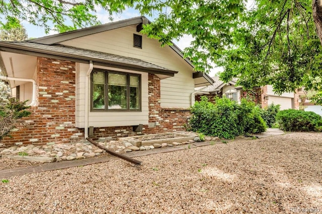 1665 W 113th Ave, Denver, CO 80234 - view of front of property featuring brick siding and a shingled roof