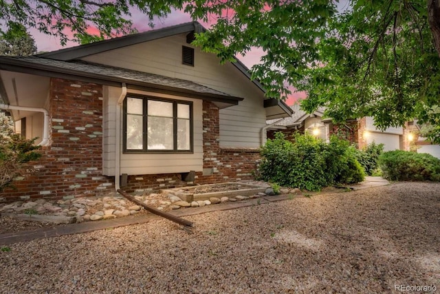 1665 W 113th Ave, Denver, CO 80234 - property exterior at dusk featuring brick siding