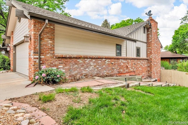 1665 W 113th Ave, Denver, CO 80234 - view of home's exterior featuring brick siding, a garage, a chimney, roof with shingles, and concrete driveway