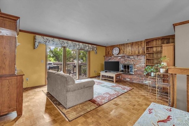 1665 W 113th Ave, Denver, CO 80234 - living area featuring ornamental molding, a brick fireplace, wooden walls, baseboards, and built in features