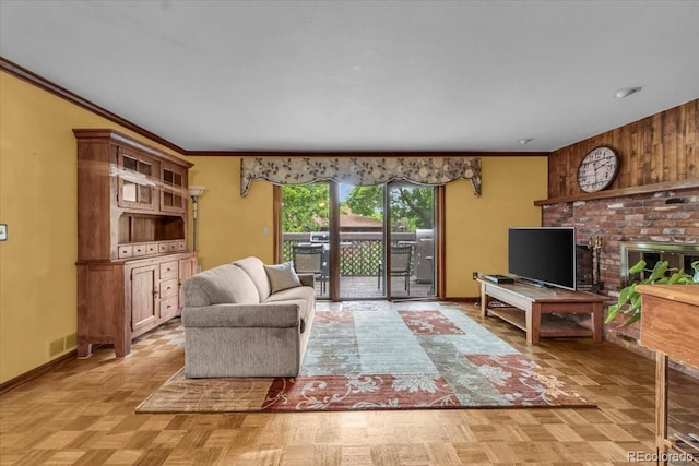 1665 W 113th Ave, Denver, CO 80234 - living room featuring ornamental molding, a brick fireplace, and baseboards