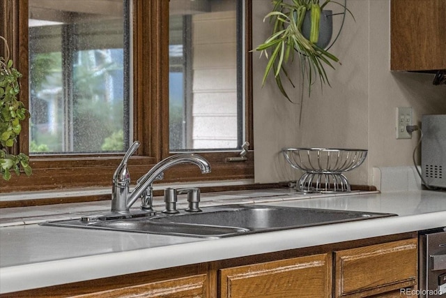 1665 W 113th Ave, Denver, CO 80234 - kitchen view of a sink and brown cabinetry