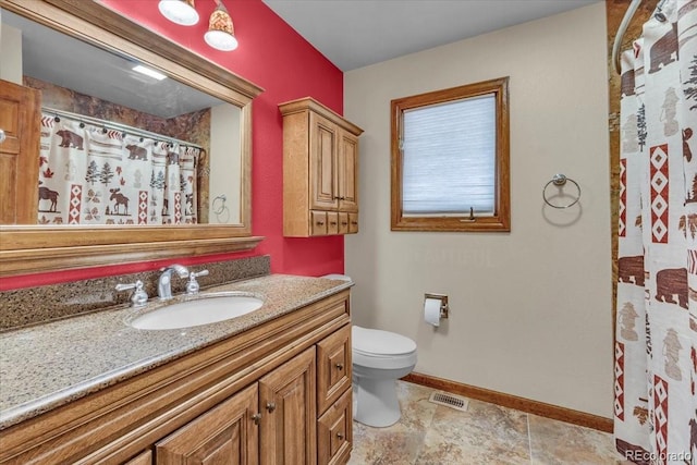 1665 W 113th Ave, Denver, CO 80234 - bathroom featuring vanity, toilet, baseboards, and a shower with shower curtain