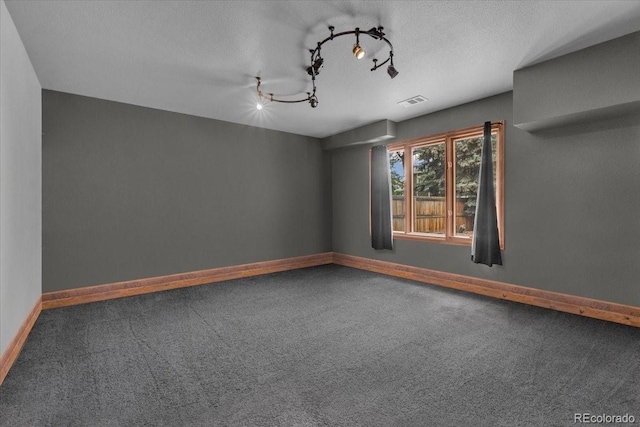 1665 W 113th Ave, Denver, CO 80234 - carpeted empty room with baseboards and rail lighting