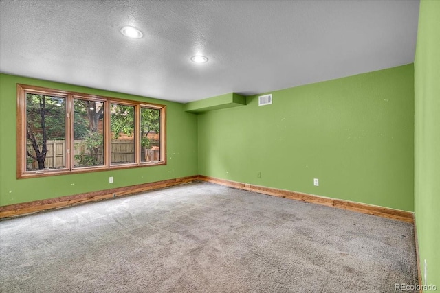 1665 W 113th Ave, Denver, CO 80234 - spare room with carpet floors, a textured ceiling, baseboards, and recessed lighting