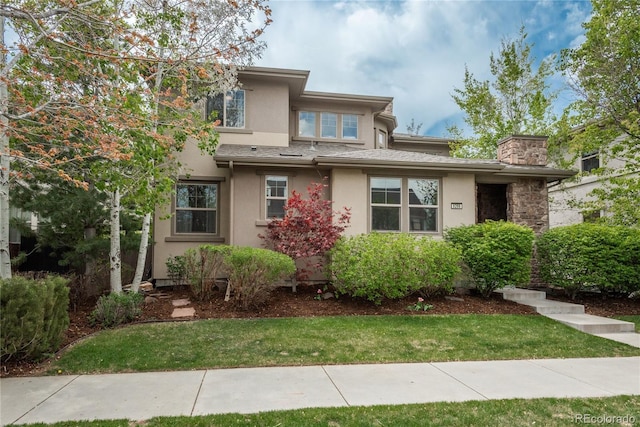 9266 E 35th Ave, Denver, CO 80238 - prairie-style house with stucco siding and a front lawn