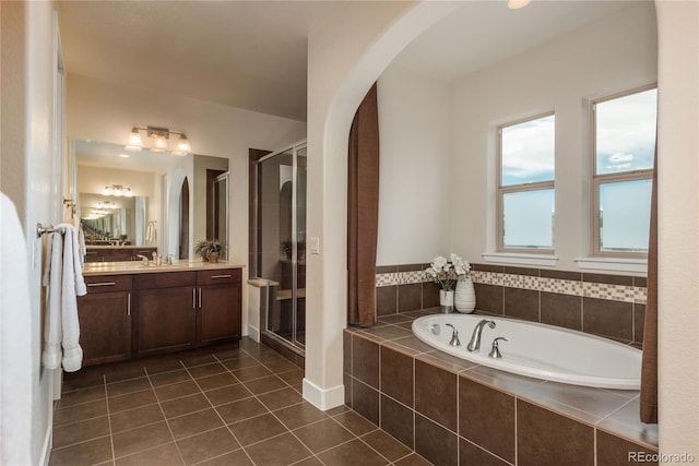 9266 E 35th Ave, Denver, CO 80238 - bathroom with vanity, a garden tub, tile patterned flooring, and a stall shower
