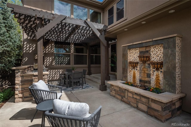 9266 E 35th Ave, Denver, CO 80238 - view of patio with a pergola, outdoor dining space, and an outdoor stone fireplace