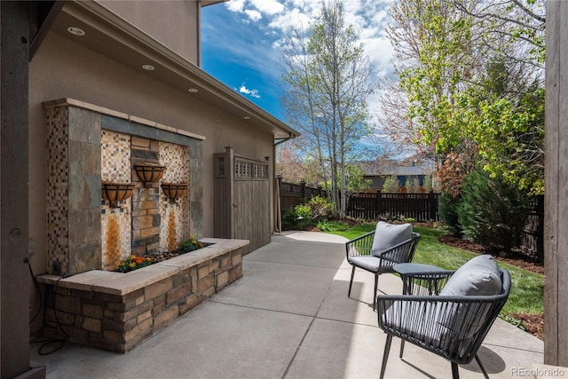 9266 E 35th Ave, Denver, CO 80238 - view of patio / terrace with a fireplace