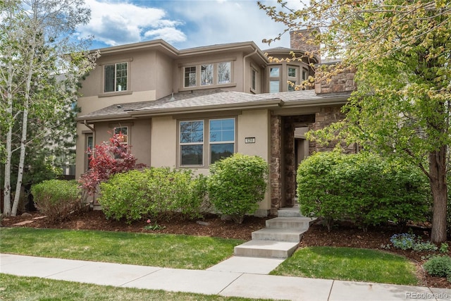 9266 E 35th Ave, Denver, CO 80238 - prairie-style house with stucco siding, a chimney, and stone siding