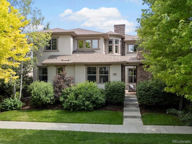 9266 E 35th Ave, Denver, CO 80238 - prairie-style house with stucco siding, a chimney, and a front yard