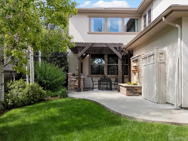9266 E 35th Ave, Denver, CO 80238 - rear view of house featuring a patio, stucco siding, and a pergola