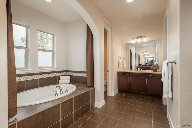 9266 E 35th Ave, Denver, CO 80238 - full bath with a garden tub, vanity, and tile patterned floors
