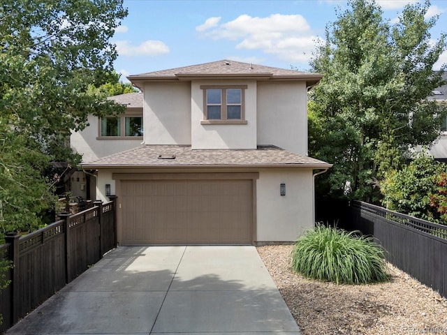 9266 E 35th Ave, Denver, CO 80238 - prairie-style home featuring stucco siding, a garage, concrete driveway, and roof with shingles