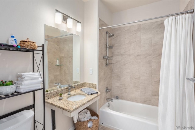 full bathroom with shower / tub combo with curtain, toilet, and sink