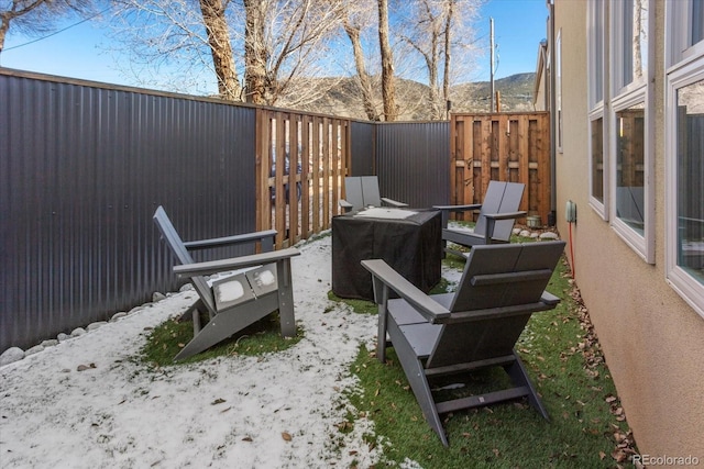 view of patio / terrace featuring a mountain view